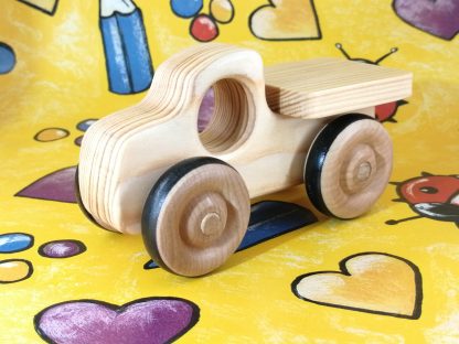 real wood toy truck on gift wrap